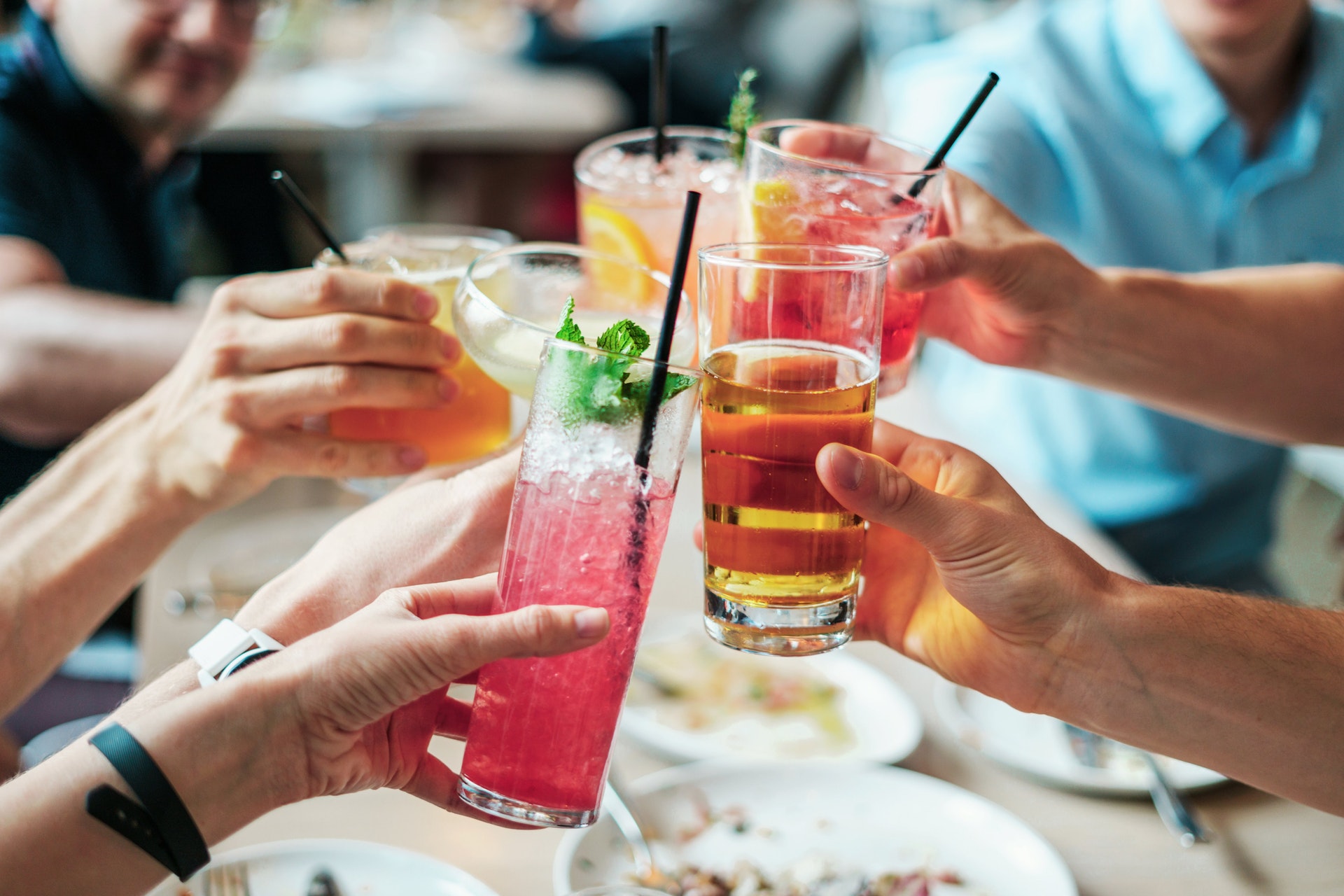 people holding drinks